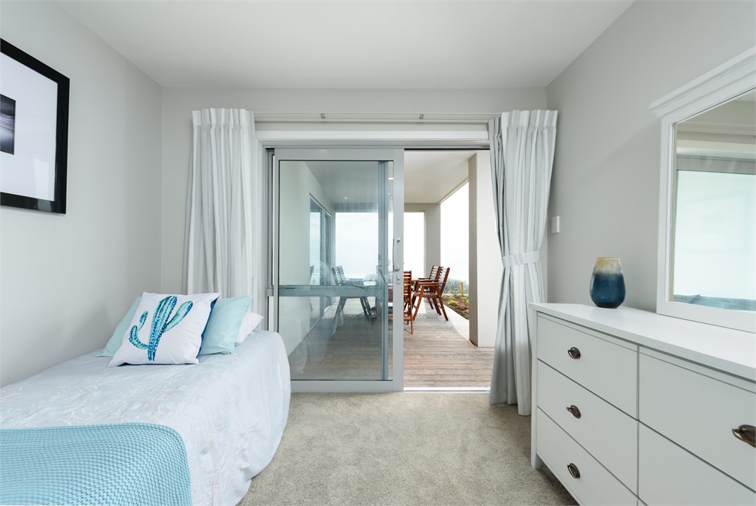 Downstairs bedroom 2 (queen and single bed)