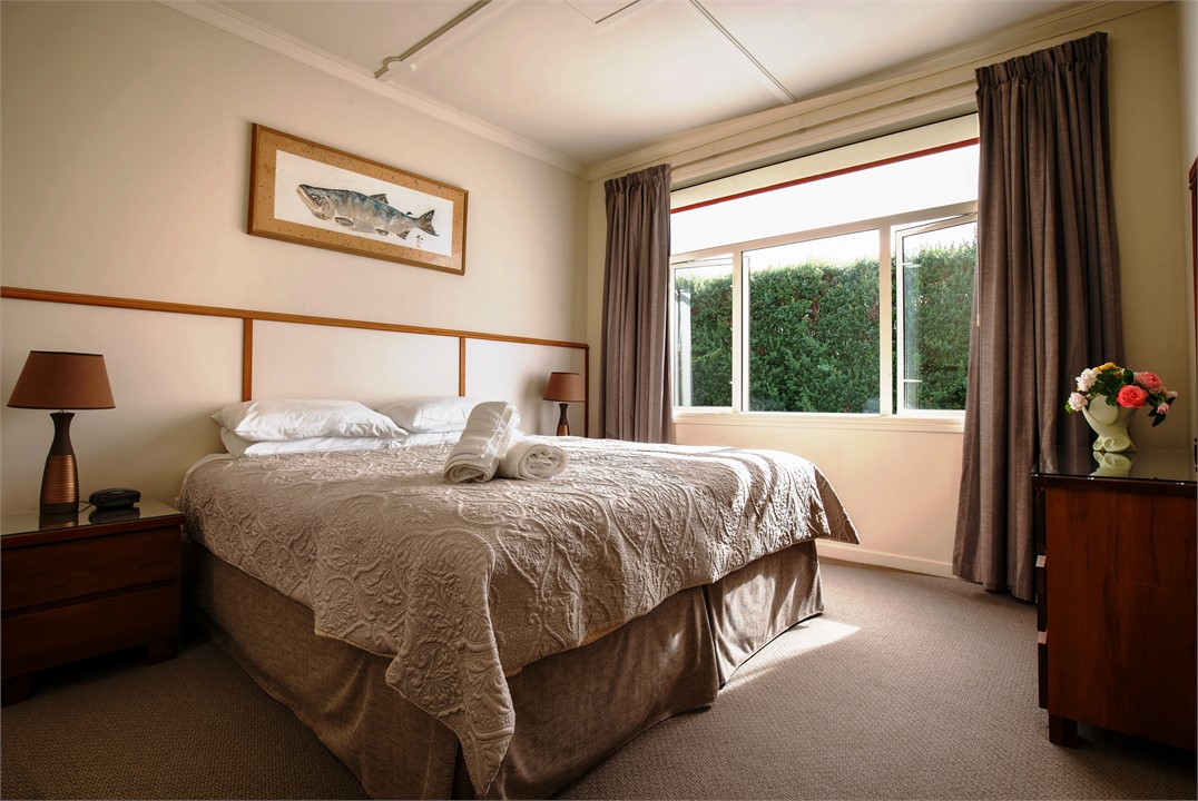 The main bedroom has a king bed and view to the ga