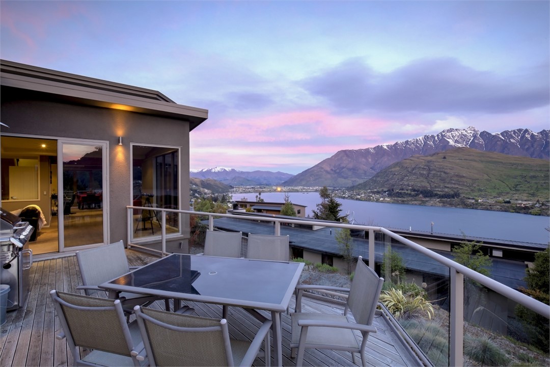 Larger of the two decks has the bbq