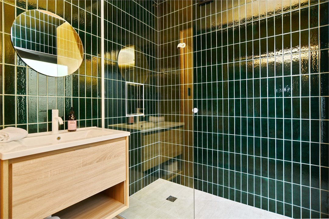 Bathroom has a shower and a toilet