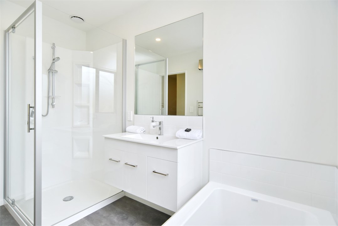 Bathroom 1 has a shower, bathtub and a separate to