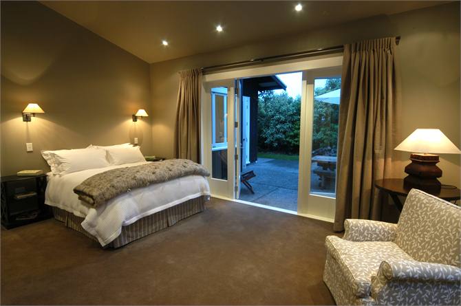 master bedroom with French doors to patio