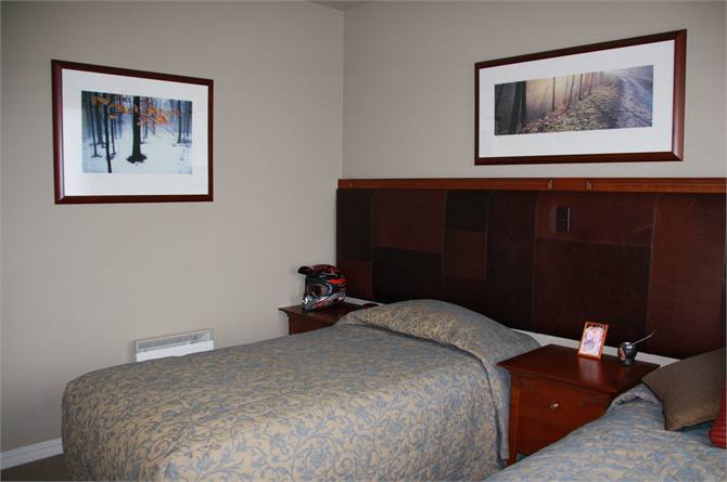 Bedroom with two king single beds.