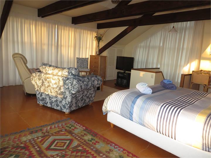 Upstairs sitting is part of huge bedroom