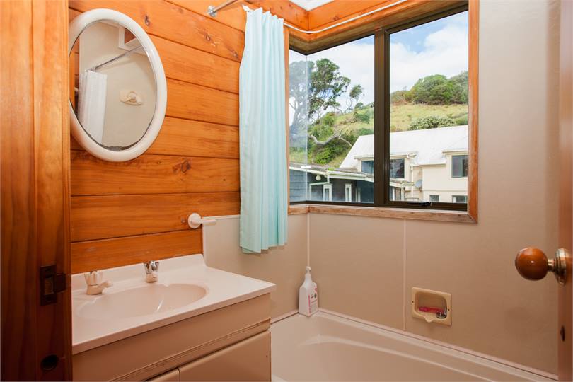 Upstairs bathroom with shower over tub