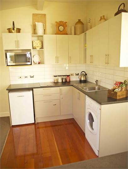 Kitchen with dishwasher and laundry