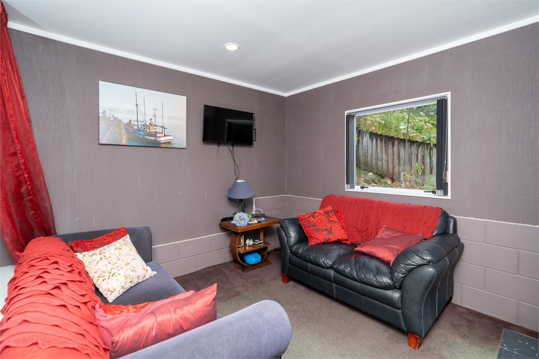 Living room with seating area and TV