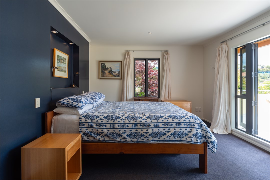 Master bedroom w/ Queen bed & door to West veranda