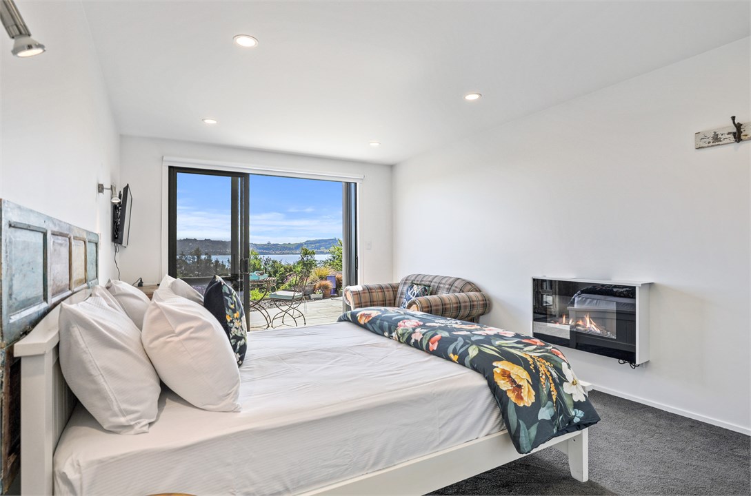 Bedroom with lake views, ensuite and gas fire