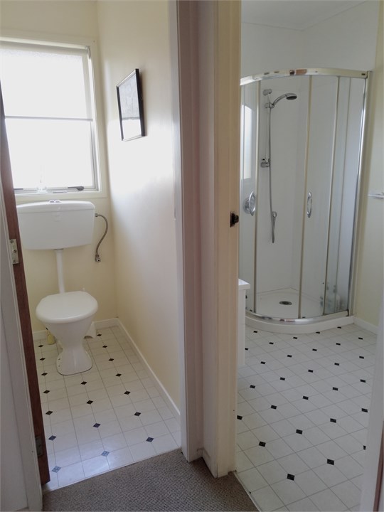 Toilet and bathroom adjacent