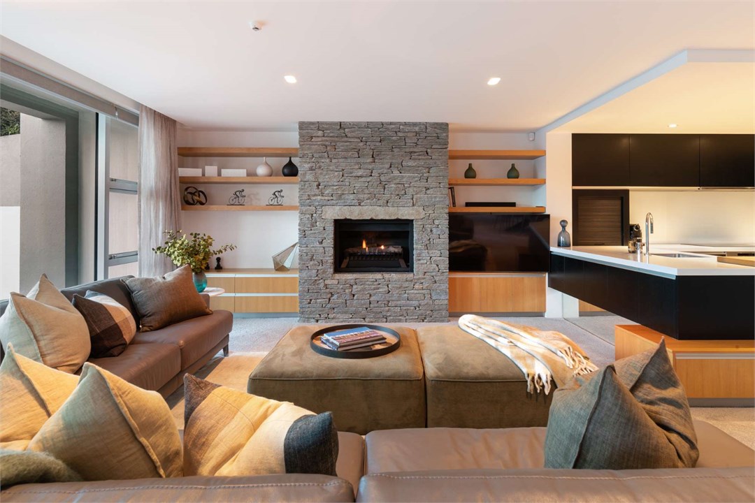 Relax by the beautiful schist fireplace