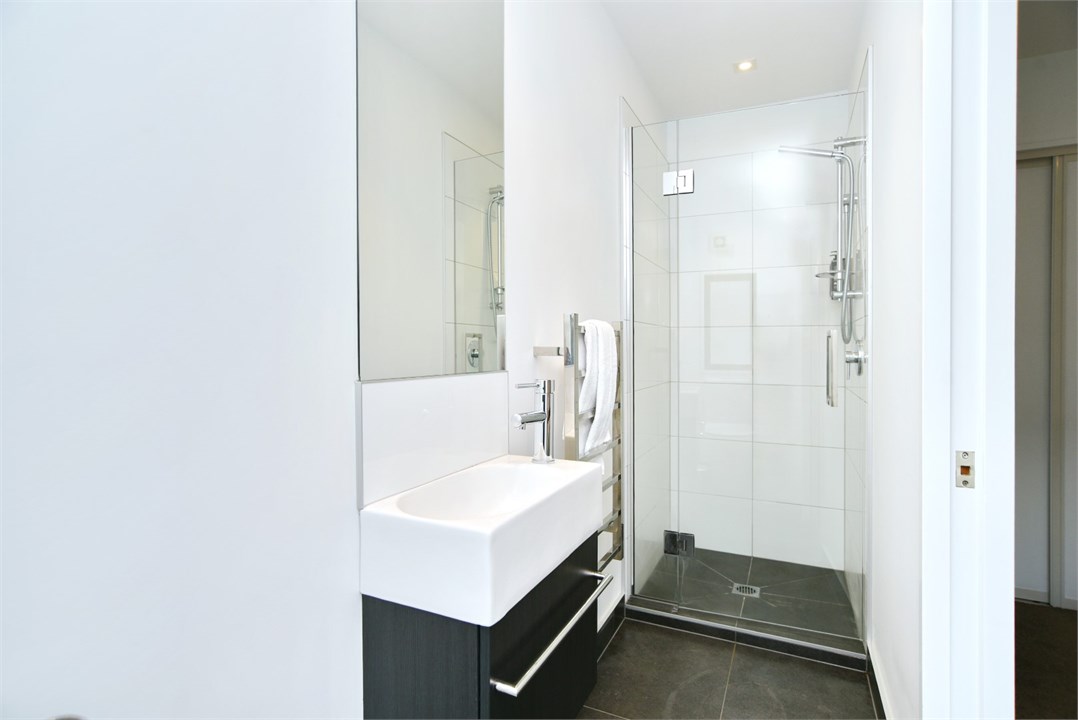 Bathroom 1 has a shower and a toilet