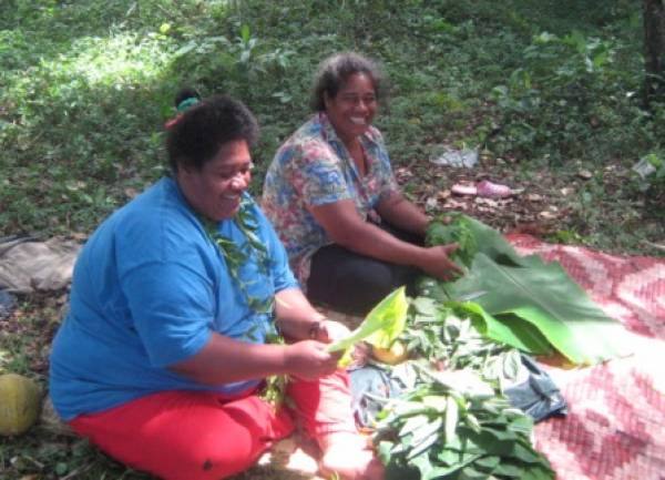 Preparing a traditional umu at One'atea for guests
