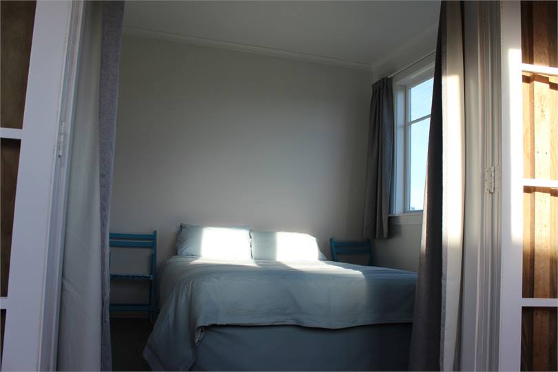 Bedroom One, 1x Queen Bed, French doors open to su