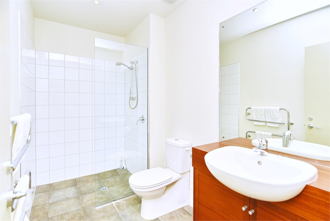 Bathroom 2 has a shower and a toilet