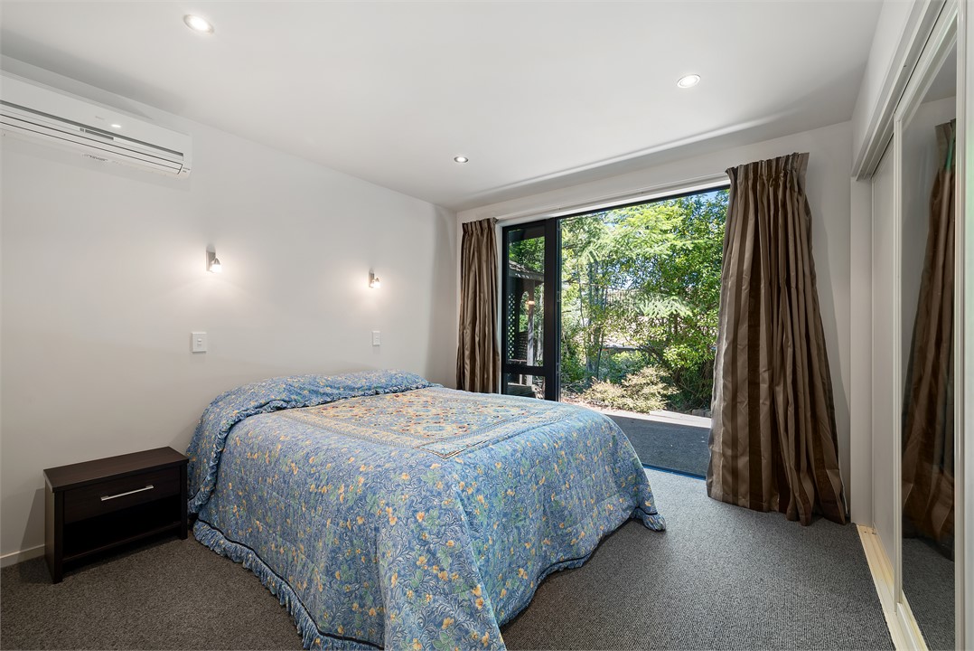 Bedroom 4 downstairs. One queen bed.