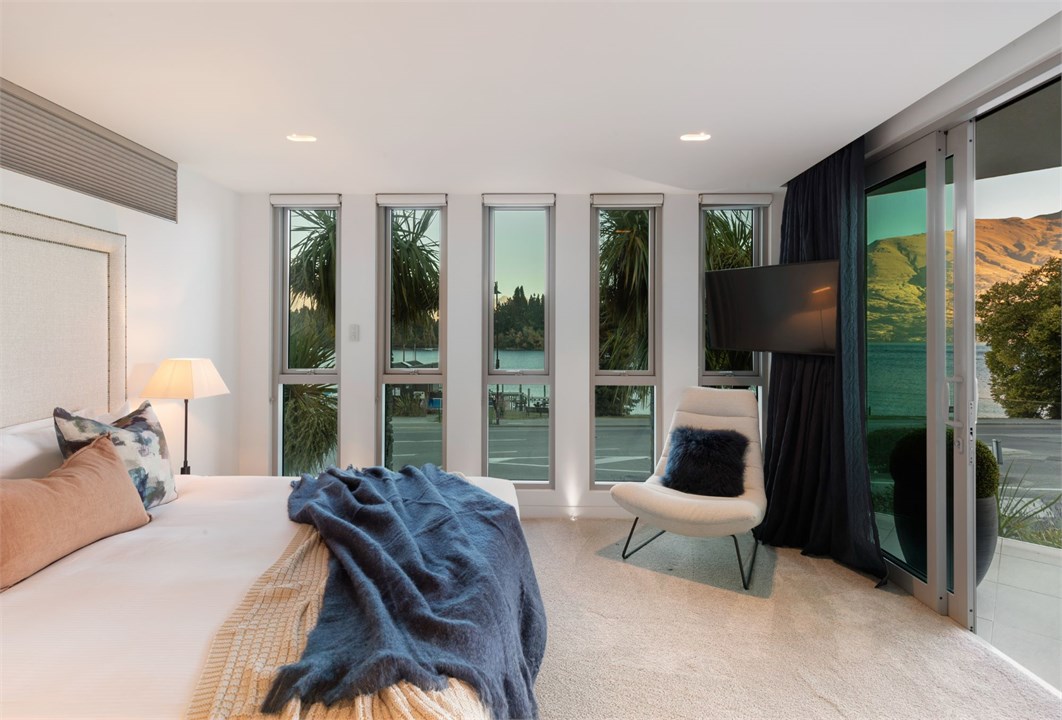 Spacious master bedroom with patio access