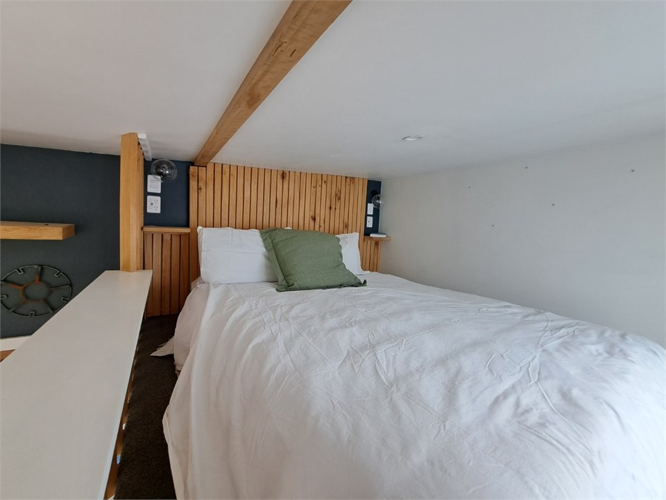 Cosy loft bedroom with a queen mattress