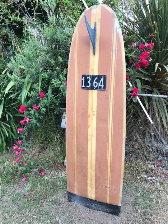 Surfboard marker at driveway
