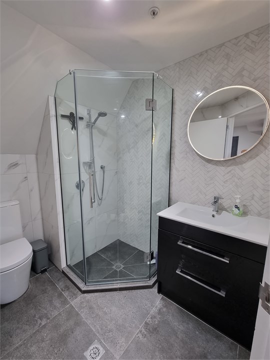 Bathroom 2 has a shower and a toilet