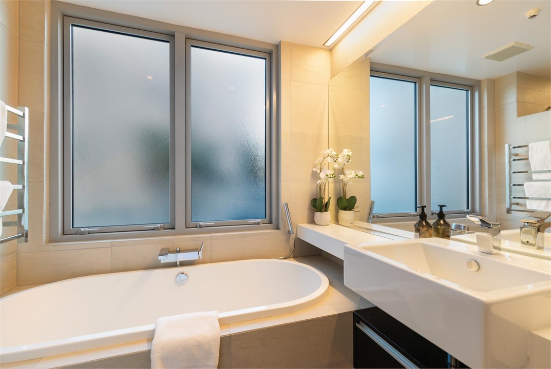 Family bathroom w/ separate tub and shower