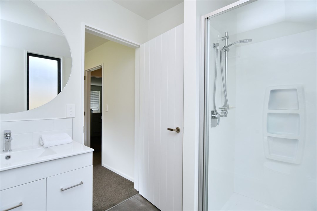 Bathroom 2 has a shower and a toilet