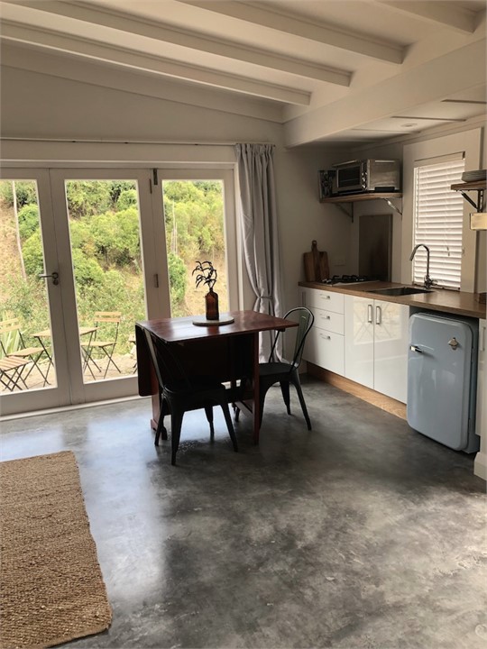 Kitchen/dining area opens onto a private terrace