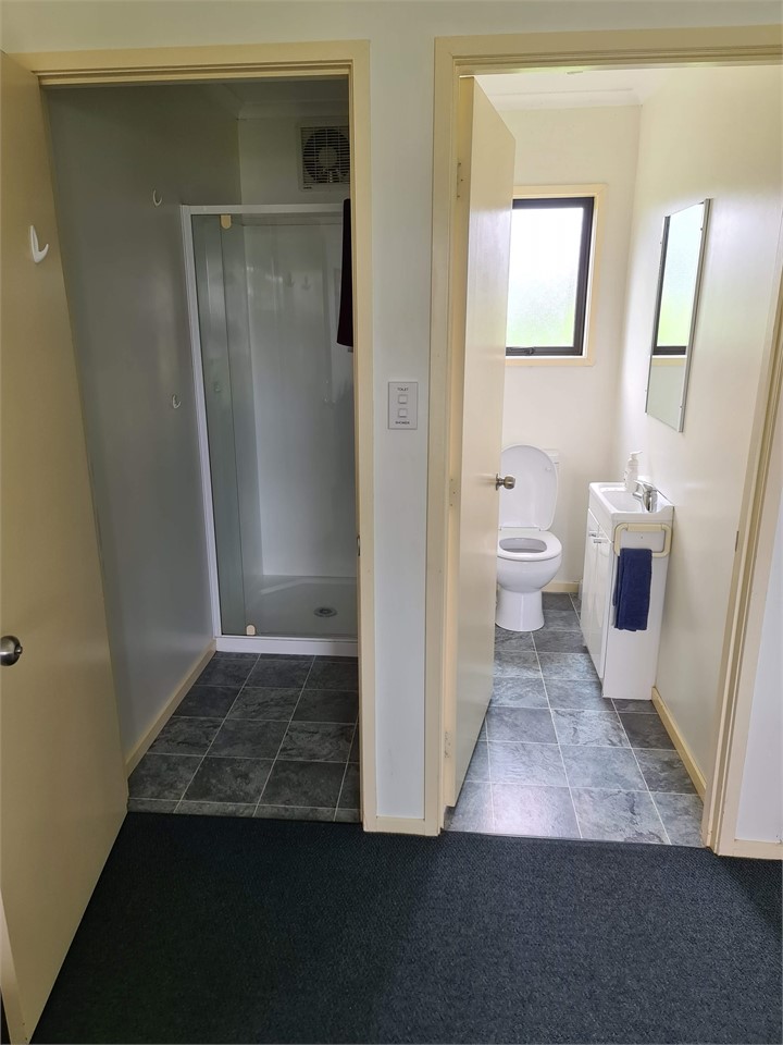 Shower with toilet beside