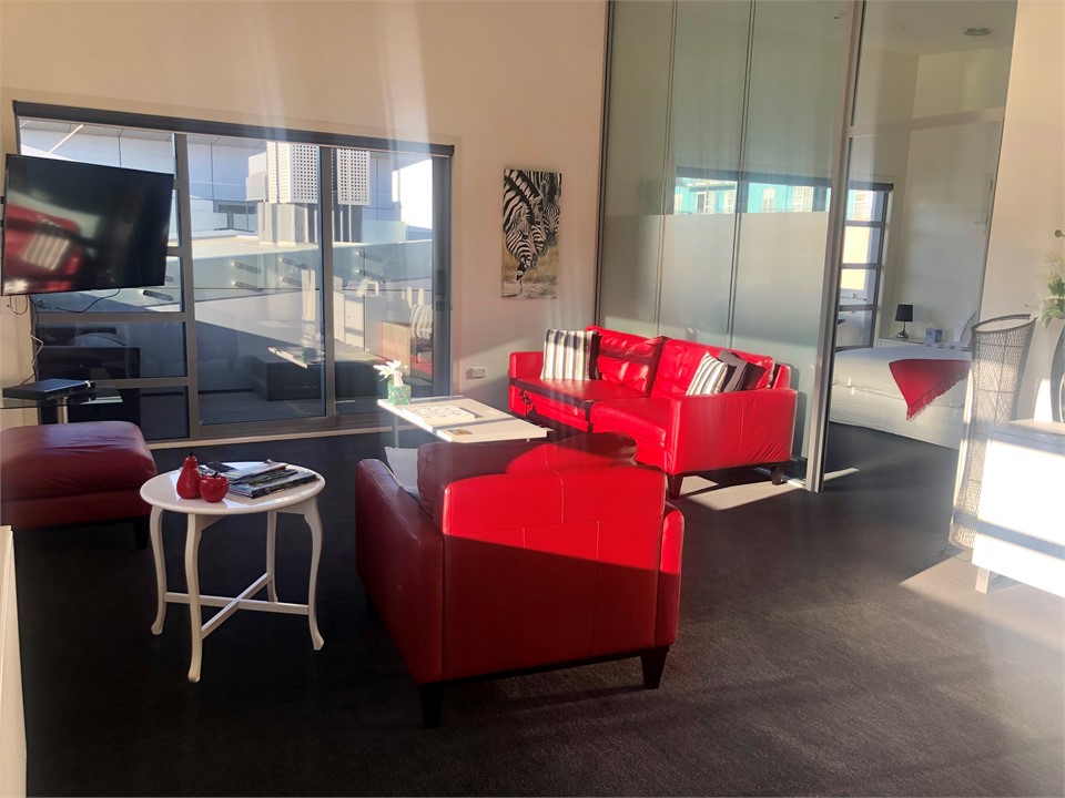 Lounge area with door through to Master Bedroom an