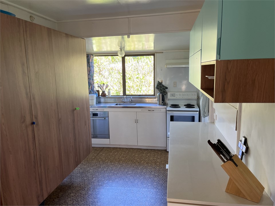 Retro kitchen with stove, fridge, microwave