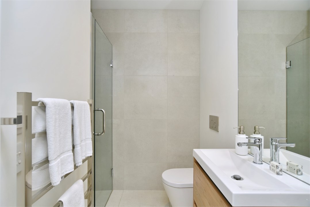 Bathroom 1 has a shower and a toilet