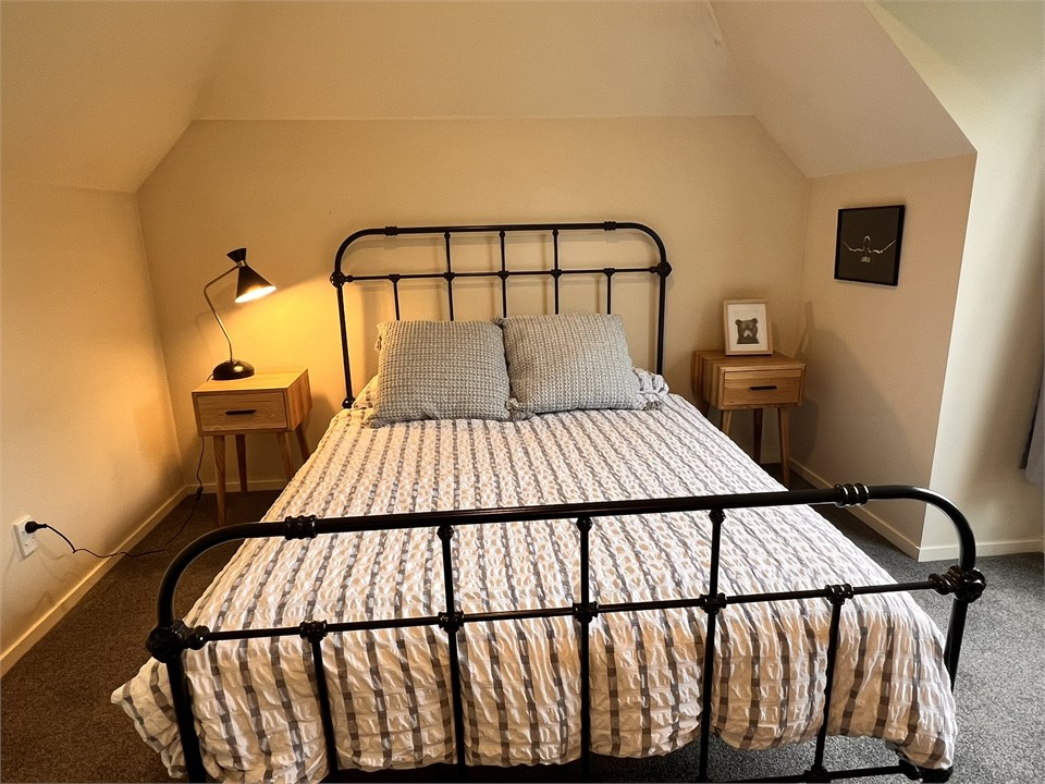 Bedroom 2 has a Queen bed and a desk