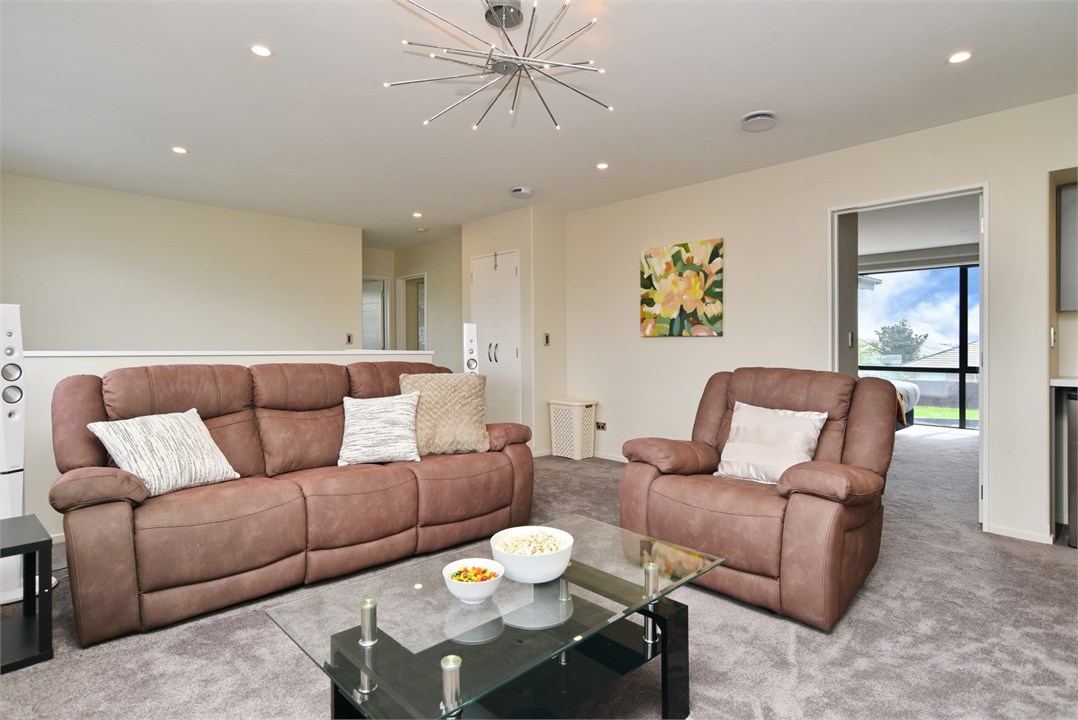 Third living area with a TV and seating (Upstairs)