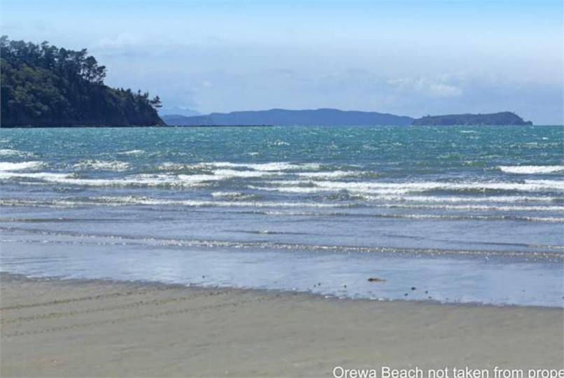 beach 15 paces across grass reserve