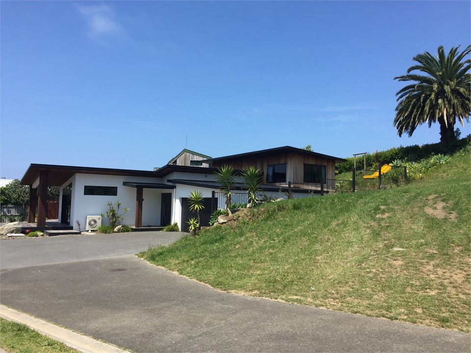 Down end of driveway with a section empty next to 