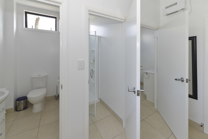 Two toilets and two showers