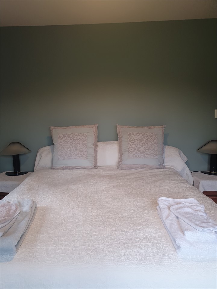 King bed at ground level same room as above.