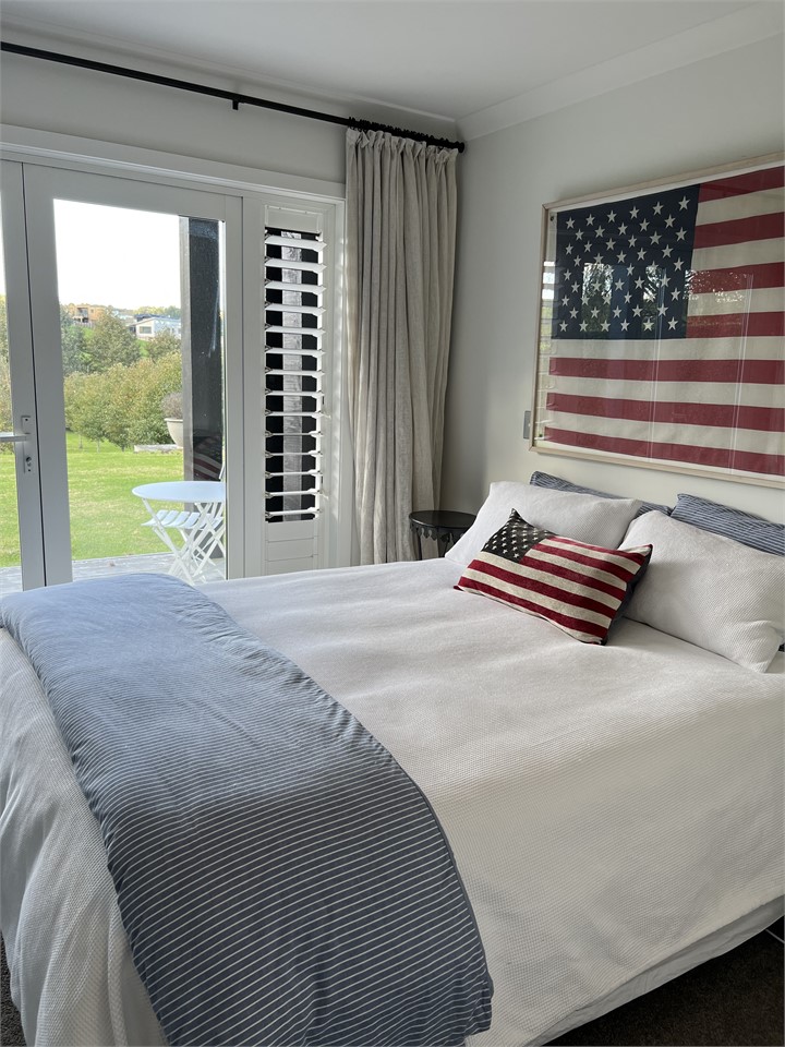 Queen Room with French doors opening to deck and l