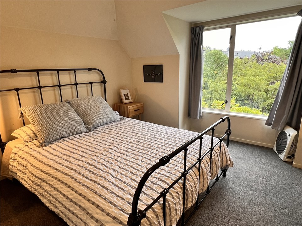 Bedroom 2 has a Queen bed and a desk