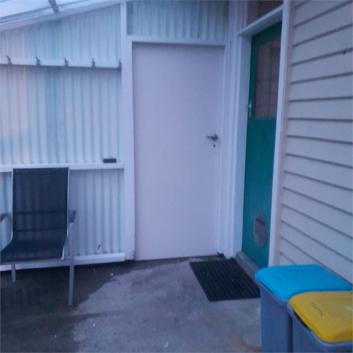 Porch, entry door, key safe is on ledge