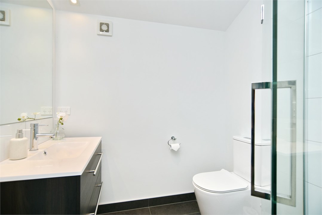 Bathroom 2 has a shower and a toilet