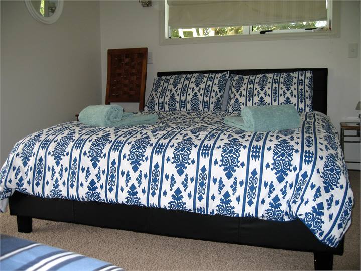 Master bedroom has 1 queen bed and 1 single bed