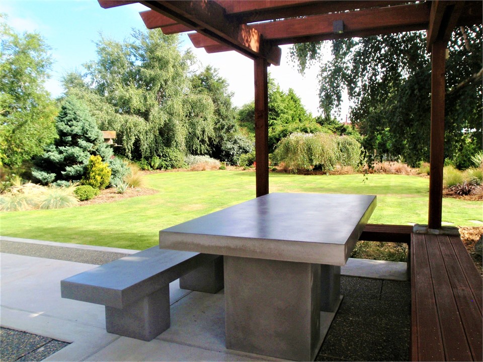 The outdoor seating area has a large BBQ