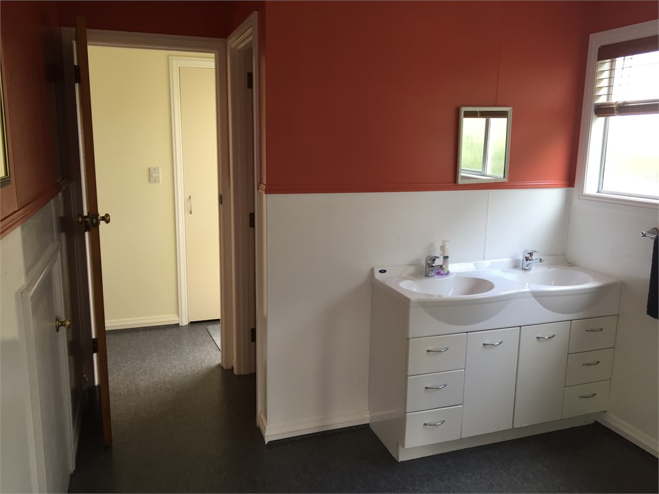 Bathroom, separate toilet behind vanity
