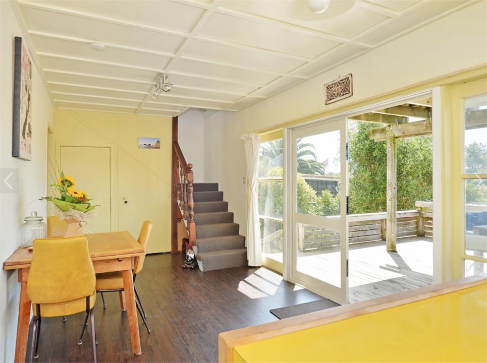 Dining area flowing outside to lower deck