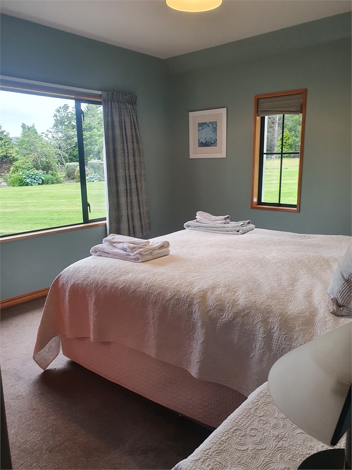 King bed at ground level and has the toilet opposi