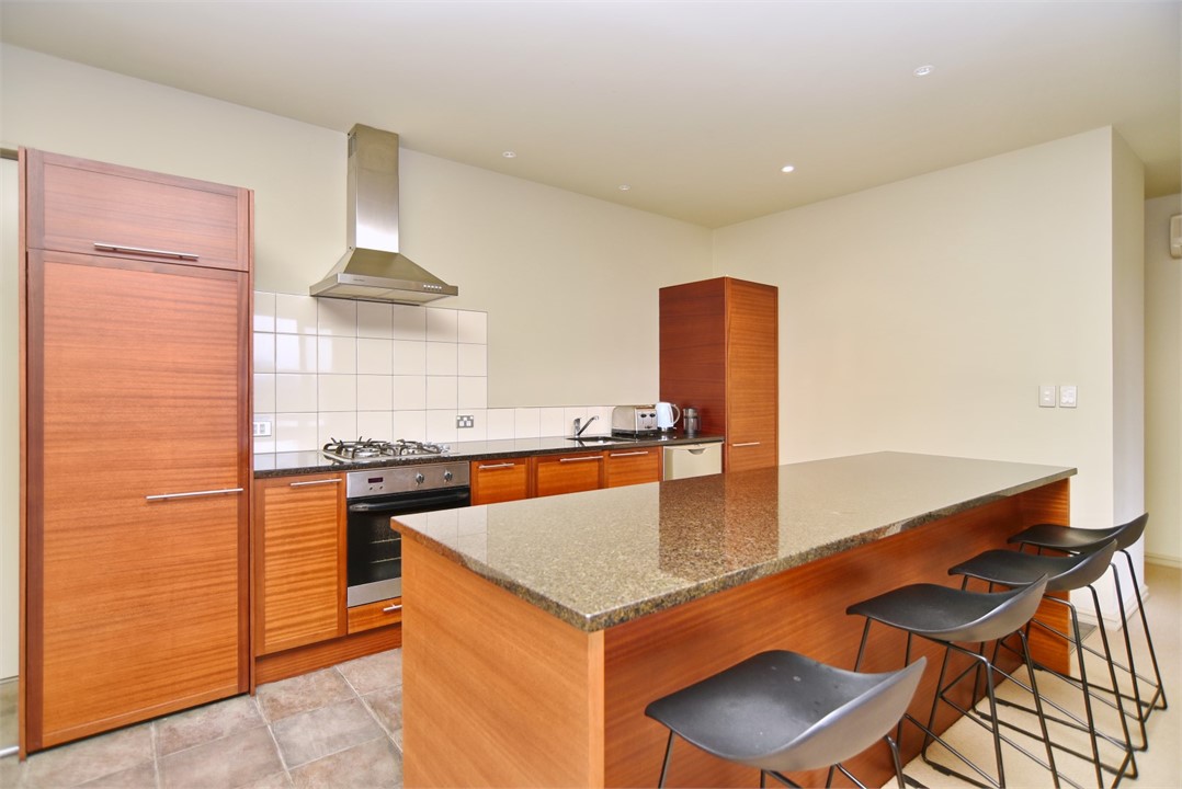 Fully equipped kitchen and a sitting area at the b
