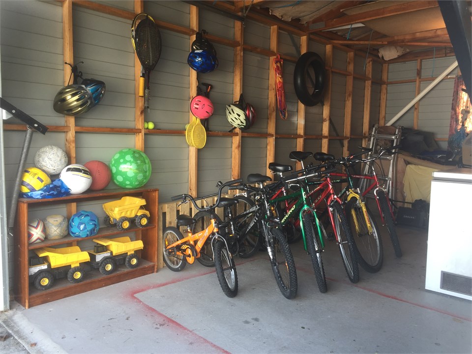 Various bikes, balls and toys available in the gar