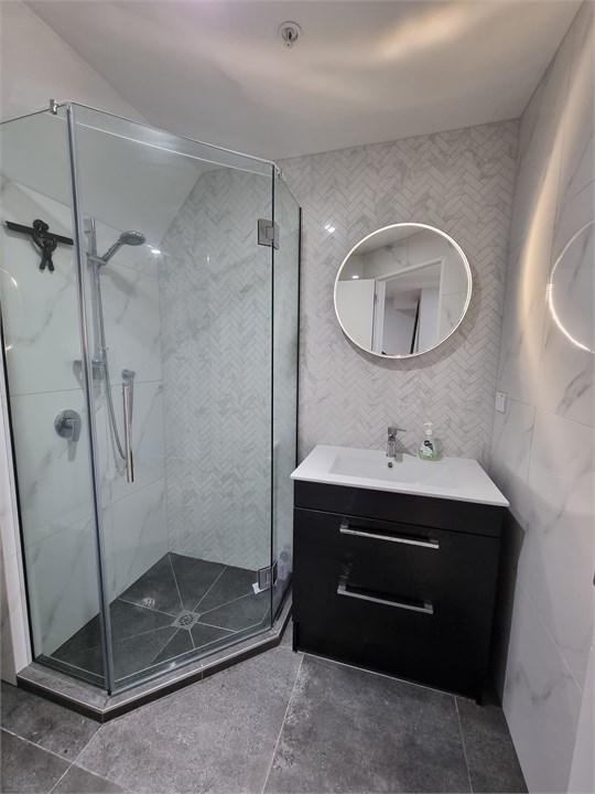 Bathroom 2 has a shower and a toilet