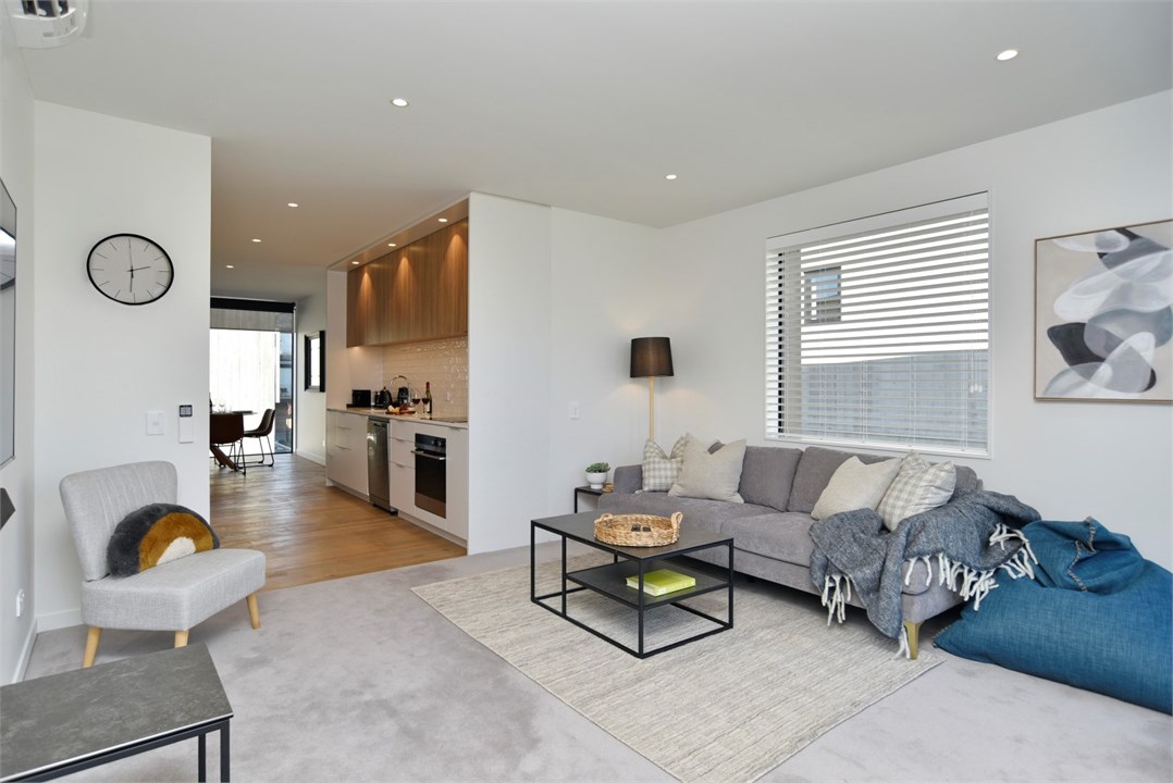 Living room has a TV and seating areas
